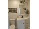 Bathroom featuring a white vanity, modern faucet, and decorative mirror at 1527 N C N St, Elwood, IN 46036