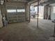 Spacious garage with open door leading to backyard with vehicle parked outside at 1527 N C N St, Elwood, IN 46036
