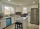 Bright kitchen featuring white cabinets, granite countertops, and stainless steel appliances at 1527 N C N St, Elwood, IN 46036