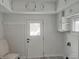 Bright and functional laundry room featuring ample white cabinetry and practical layout at 1527 N C N St, Elwood, IN 46036