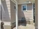 Cozy patio area with a wrought iron bench, perfect for relaxing outdoors at 1527 N C N St, Elwood, IN 46036