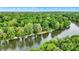 Stunning aerial view of a riverfront property surrounded by lush greenery and a private dock at 1530 E 75Th St, Indianapolis, IN 46240