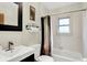 Clean bathroom featuring a shower-tub combo, neutral finishes, and a sleek vanity at 1530 E 75Th St, Indianapolis, IN 46240
