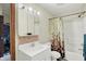 Well-lit bathroom featuring a vanity with storage and a shower-tub combination at 1530 E 75Th St, Indianapolis, IN 46240