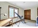 Bright bedroom featuring a large window, a spacious closet, and a wooden desk at 1530 E 75Th St, Indianapolis, IN 46240