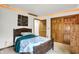 Bedroom featuring stylish wood trim, a comfortable bed and a spacious closet at 1530 E 75Th St, Indianapolis, IN 46240