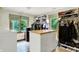 Spacious walk-in closet offering ample storage with windows and custom organizers at 1530 E 75Th St, Indianapolis, IN 46240