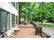 Multi-level deck with outdoor seating and view of the lawn and treeline at 1530 E 75Th St, Indianapolis, IN 46240