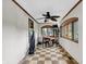 Bright dining area featuring a ceiling fan, ample windows, and checkered tile flooring at 1530 E 75Th St, Indianapolis, IN 46240