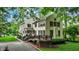 Inviting two-story home featuring a spacious deck and lush green landscaping at 1530 E 75Th St, Indianapolis, IN 46240