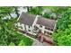 Aerial view of a home with large deck and views of the surrounding landscape and lake at 1530 E 75Th St, Indianapolis, IN 46240