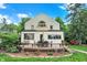 Charming two-story home with unique architectural details and an inviting deck with outdoor seating at 1530 E 75Th St, Indianapolis, IN 46240