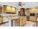 Spacious kitchen with an island, tile flooring, and stainless steel appliances at 1530 E 75Th St, Indianapolis, IN 46240