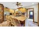 Bright kitchen boasts stainless appliances, island seating, and warm design at 1530 E 75Th St, Indianapolis, IN 46240