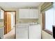 Bright laundry room with modern washer and dryer and plenty of storage space at 1530 E 75Th St, Indianapolis, IN 46240