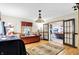 Bright living room with hardwood floors, Tiffany style lighting, and glass paneled doors at 1530 E 75Th St, Indianapolis, IN 46240