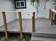 Low deck and entry door to the house creates a welcoming entrance and outdoor living space at 1545 Finley Ave, Indianapolis, IN 46203