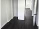 Bright hallway featuring wood-look floors and white trim at 1545 Finley Ave, Indianapolis, IN 46203