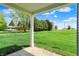 Covered patio in a large backyard, perfect for outdoor relaxation and enjoying the serene surroundings at 1639 Clover Crossing Dr, Greenfield, IN 46140