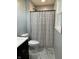 Bathroom featuring a vanity, toilet, and shower with a patterned curtain at 1725 E 100 S, Lebanon, IN 46052