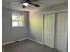This bedroom features a ceiling fan, window, and closet at 1725 E 100 S, Lebanon, IN 46052