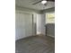 Bedroom with sliding closet door and view to bathroom at 1725 E 100 S, Lebanon, IN 46052