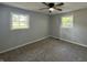Bedroom with two large windows and neutral-colored walls at 1725 E 100 S, Lebanon, IN 46052