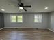 Bedroom with two windows overlooking a green yard, neutral paint, and ceiling fan at 1725 E 100 S, Lebanon, IN 46052