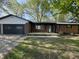 Charming single-story brick home with an attached garage and inviting front porch at 1725 E 100 S, Lebanon, IN 46052