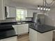 Updated kitchen featuring white cabinets, stainless steel appliances and natural light at 1725 E 100 S, Lebanon, IN 46052