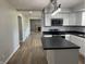 Modern kitchen featuring white cabinets, dark countertops and stainless steel appliances at 1725 E 100 S, Lebanon, IN 46052