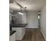 Bright kitchen with wood floors, center island and modern light fixture at 1725 E 100 S, Lebanon, IN 46052