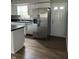 Modern kitchen featuring white cabinets, dark countertops and stainless steel appliances at 1725 E 100 S, Lebanon, IN 46052