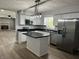 Modern kitchen with white cabinets, stainless steel appliances, and center island at 1725 E 100 S, Lebanon, IN 46052