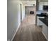 Open floor plan from kitchen featuring a fireplace and vinyl wood flooring at 1725 E 100 S, Lebanon, IN 46052