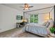 Bedroom featuring a four poster bed, ceiling fan, and desk at 1832 Live Oak Ct, Avon, IN 46123