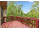A spacious deck with views of lush green trees and a bright blue sky, perfect for outdoor enjoyment at 1832 Live Oak Ct, Avon, IN 46123