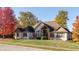 Beautiful single Gathering home featuring a stone and brick facade and colorful trees at 1832 Live Oak Ct, Avon, IN 46123