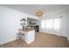 Stylish dining area with barstool seating, decorative shelving, and a view to the updated kitchen at 1912 Broadway St, Anderson, IN 46012