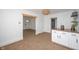 Dining area featuring modern lighting, built-in cabinets, and an open view to the living room at 1912 Broadway St, Anderson, IN 46012