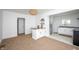 View from the kitchenette showing stylish bar seating and an updated kitchen at 1912 Broadway St, Anderson, IN 46012