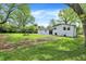 The backyard features a green lawn and a picnic table, perfect for outdoor gatherings at 1944 Galeston Ct, Indianapolis, IN 46229
