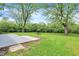 Lush backyard with a picnic table and ample space for outdoor activities and relaxation at 1944 Galeston Ct, Indianapolis, IN 46229
