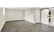 Spacious basement featuring modern floors, white trim, and laundry closet with sliding barn door at 1944 Galeston Ct, Indianapolis, IN 46229