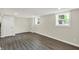 Large basement living area featuring updated windows, modern flooring, and neutral paint at 1944 Galeston Ct, Indianapolis, IN 46229