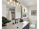Bathroom with granite vanity, black fixtures, and decorative mirror with view of shower at 1944 Galeston Ct, Indianapolis, IN 46229