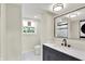 Elegant bathroom with a modern vanity, sleek fixtures and a large mirror for a luxurious feel at 1944 Galeston Ct, Indianapolis, IN 46229