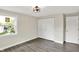 Comfortable bedroom showcasing a window and ample closet space, complemented by elegant flooring at 1944 Galeston Ct, Indianapolis, IN 46229
