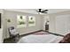 Bedroom with backyard view, hardwood floors, ceiling fan and access to Primary bath at 1944 Galeston Ct, Indianapolis, IN 46229