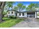 Charming home with a well-maintained lawn, featuring fresh landscaping and a driveway leading to an attached garage at 1944 Galeston Ct, Indianapolis, IN 46229